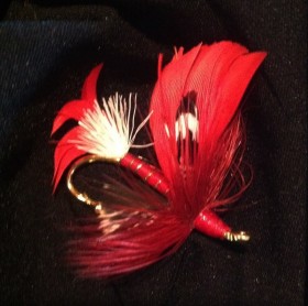 Red, White and Black fly fishing feather lapel pin.